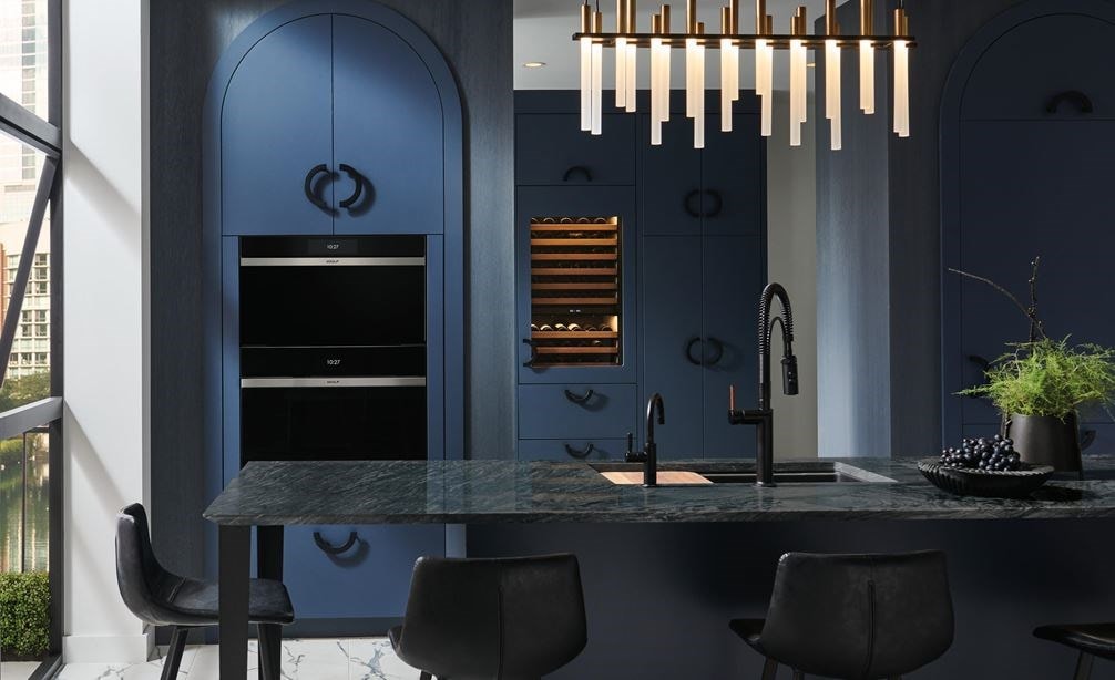 Wolf Contemporary Steam Oven (CSO3050CM) set over a Wolf Contemporary Single Oven (SO30CM) in midnight blue arched cabinets